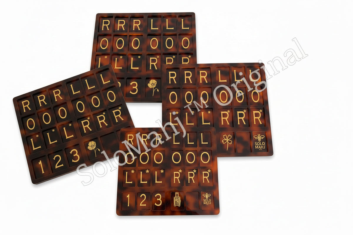 Three tortoiseshell patterned chocolate bars with letter and number designs on a white background.
