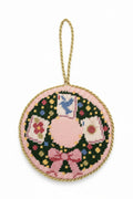  "Handcrafted needlepoint mahjong wreath ornament with vibrant tile motifs in red, pink, green, and gold"