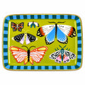 A rectangular ceramic plate with rounded corners, featuring a yellow-green center decorated with various colorful butterflies and moths, and a blue and green checkered border. The plate is photographed from above on a gray fabric surface with a yellow honeycomb pattern.