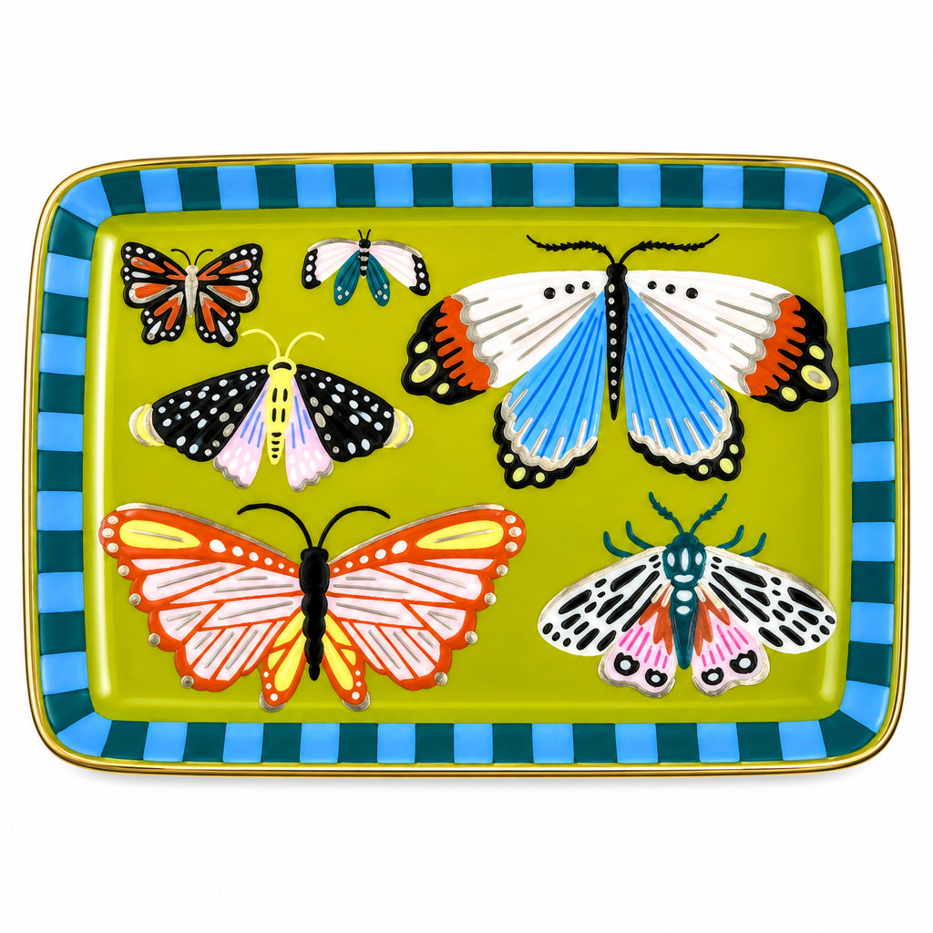 A rectangular ceramic plate with rounded corners, featuring a yellow-green center decorated with various colorful butterflies and moths, and a blue and green checkered border. The plate is photographed from above on a gray fabric surface with a yellow honeycomb pattern.